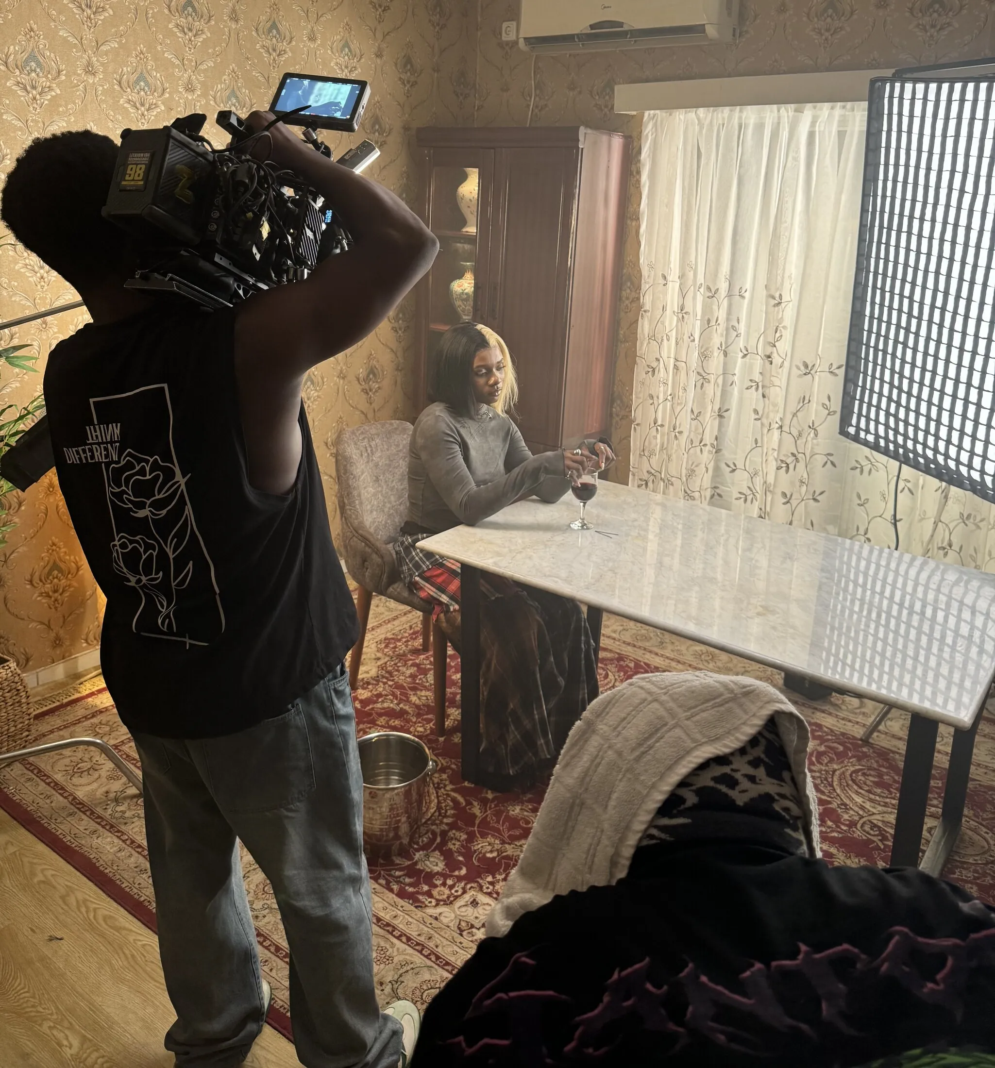 A campaign treatment being filmed on set